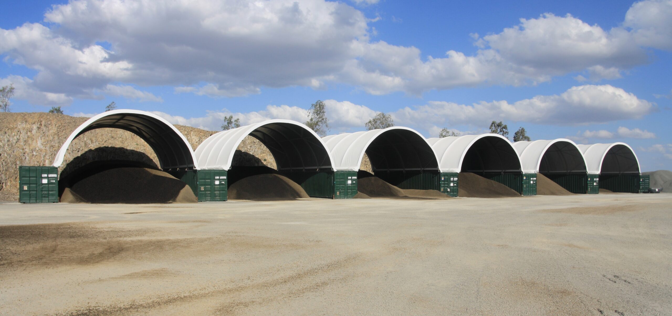 Bulk storage with container mounted dome shelters